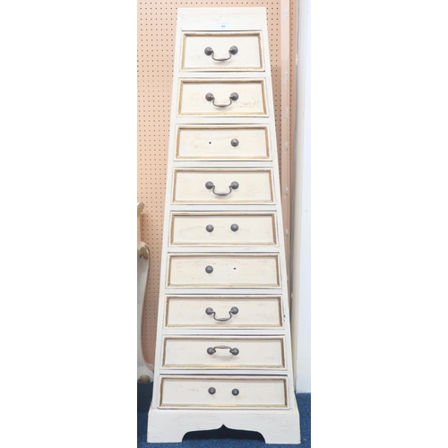 49 - A contemporary white painted stylized graduating chest of nine drawers on plinth base, 144cm high x ... 