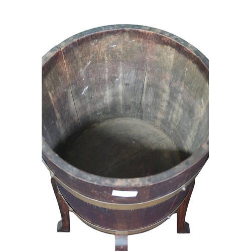 5 - An early 20th century oak R A Lister Co Ltd coopered planter on stand, 75cm high x 37cm diameter