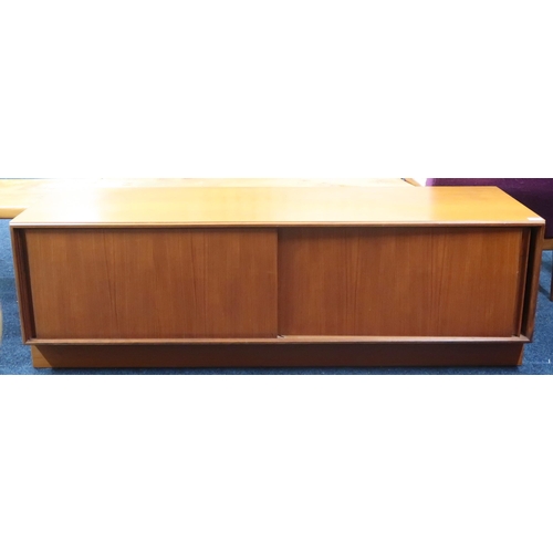 55 - A mid 20th century teak G Plan record cabinet with sliding doors on plinth base, 49cm high x 153cm w... 