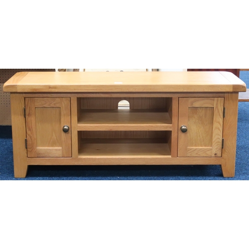 56 - A contemporary white oak coffee table with two open shelves flanked by cabinet doors on square taper... 