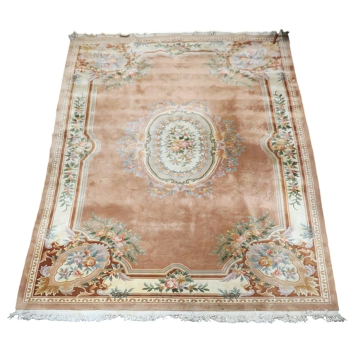 64 - An impressively large deep pile Aubusson style carpet with floral patterned central medallion within... 