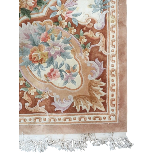 64 - An impressively large deep pile Aubusson style carpet with floral patterned central medallion within... 