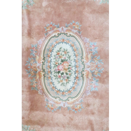 64 - An impressively large deep pile Aubusson style carpet with floral patterned central medallion within... 