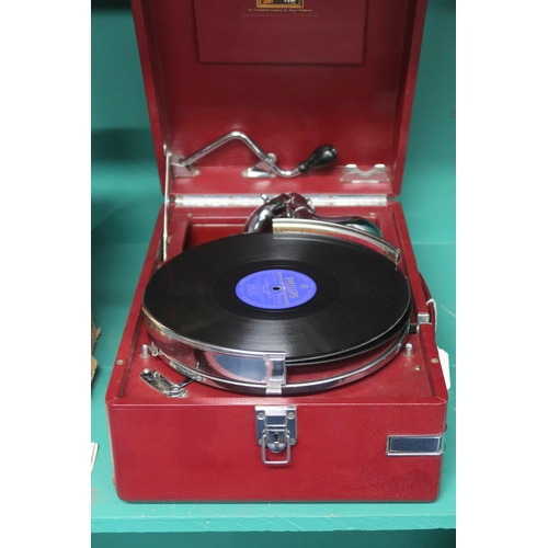 71 - An early 20th century HMV (His masters voice) model 102 red vinyl cased portable gramophone in origi... 