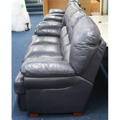 76 - A modern black vinyl upholstered three piece suite comprising three seater sofa and pair of recliner... 