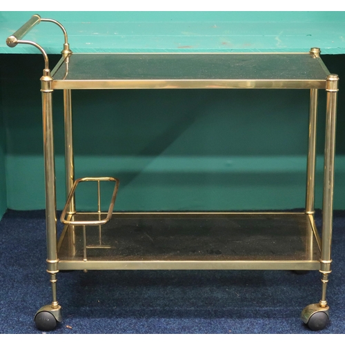 81 - A mid 20th century gilded framed two tier drinks trolled with glass shelves and bottle holder on cas... 