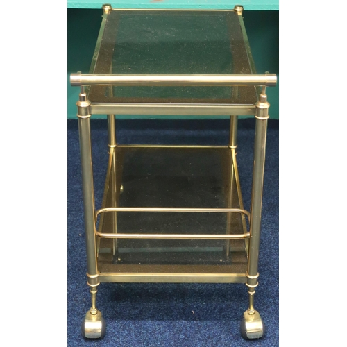 81 - A mid 20th century gilded framed two tier drinks trolled with glass shelves and bottle holder on cas... 