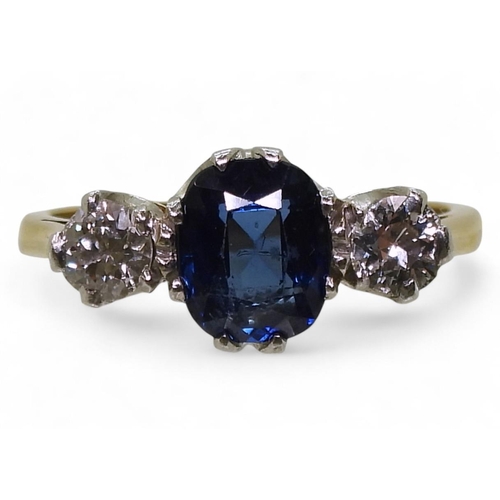 701 - An 18ct and platinum, sapphire and diamond ring, the middle sapphire measures approx 7.2mm x 6mm x 3... 