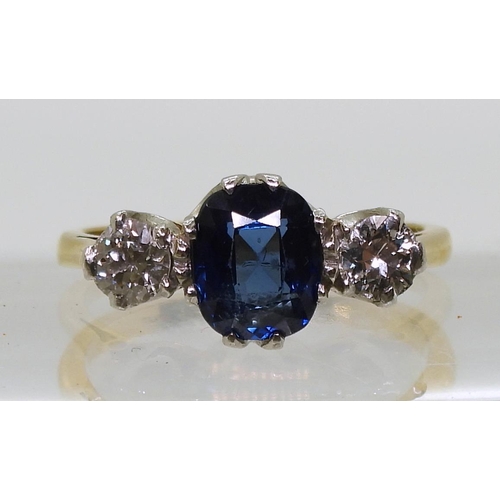 701 - An 18ct and platinum, sapphire and diamond ring, the middle sapphire measures approx 7.2mm x 6mm x 3... 