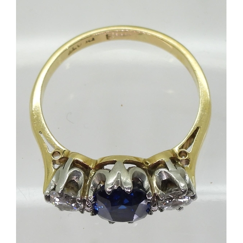 701 - An 18ct and platinum, sapphire and diamond ring, the middle sapphire measures approx 7.2mm x 6mm x 3... 