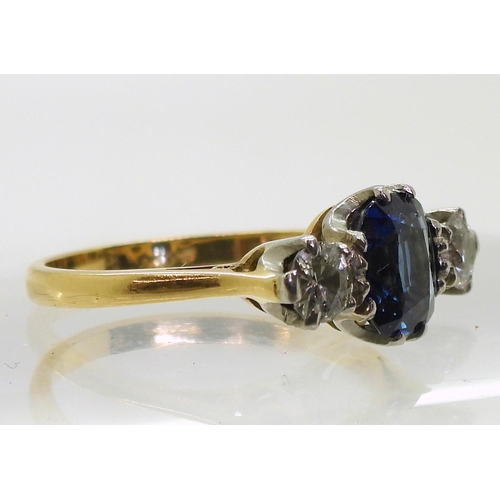 701 - An 18ct and platinum, sapphire and diamond ring, the middle sapphire measures approx 7.2mm x 6mm x 3... 