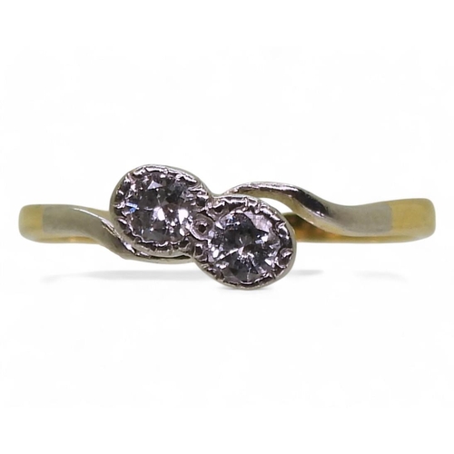 708 - An 18ct gold and platinum Twin stone diamond ring, set with estimated approx 0.20cts together, size ... 