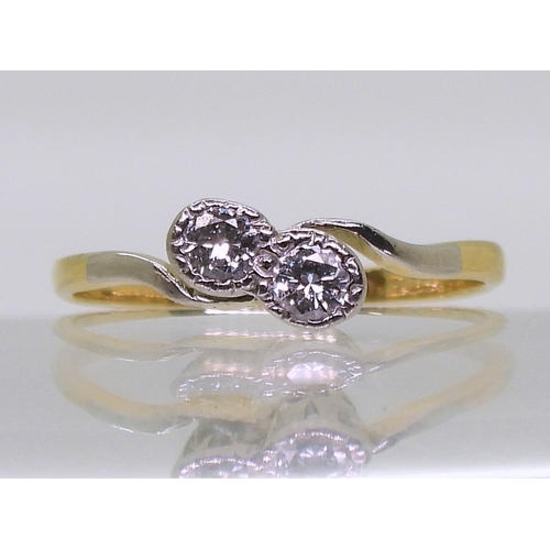 708 - An 18ct gold and platinum Twin stone diamond ring, set with estimated approx 0.20cts together, size ... 