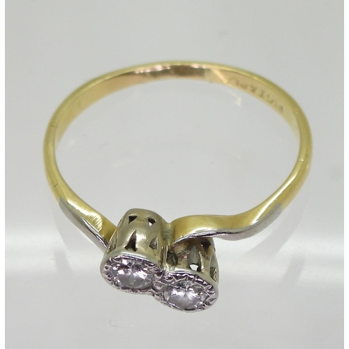 708 - An 18ct gold and platinum Twin stone diamond ring, set with estimated approx 0.20cts together, size ... 