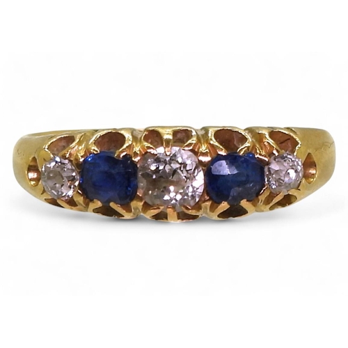 722 - A bright yellow metal ring, set with three old cut diamonds of estimated approx 0.75cts combined and... 