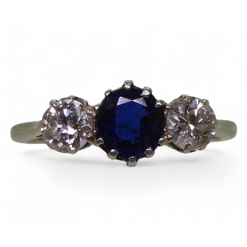 737 - An 18ct white gold and platinum sapphire and diamond three stone ring. The sapphire measures approx ... 