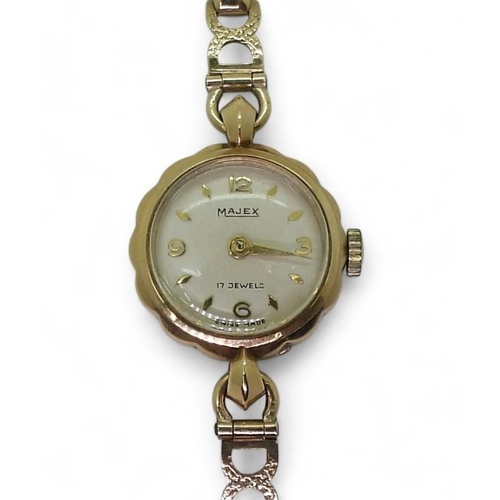 745 - A 9ct gold ladies Majex watch and strap, weight including mechanism 12.6gms 