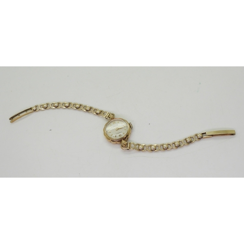 745 - A 9ct gold ladies Majex watch and strap, weight including mechanism 12.6gms 