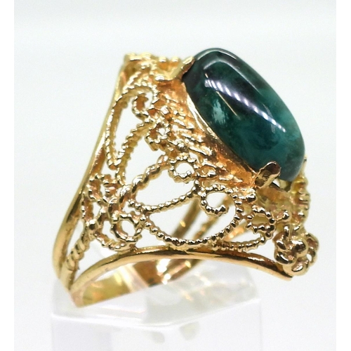 756 - A 14k gold filigree ring set with a malachite, size M1/2, weight 6.9gms