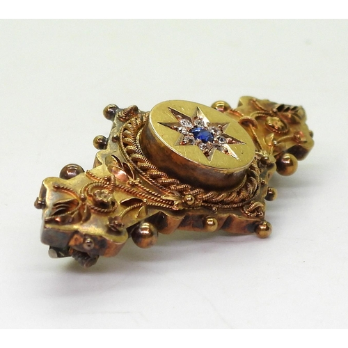 763 - A 15ct gold locket back brooch set with a sapphire and diamond star, length 4.7cm, weight 6.2gms