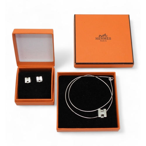 781 - A Hermes 'H' CUBE pendant and earrings both in original boxes, the pendant with a silver snake chain... 