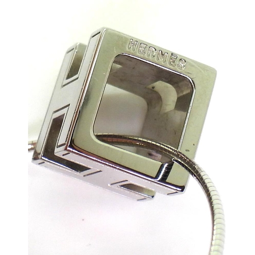 781 - A Hermes 'H' CUBE pendant and earrings both in original boxes, the pendant with a silver snake chain... 