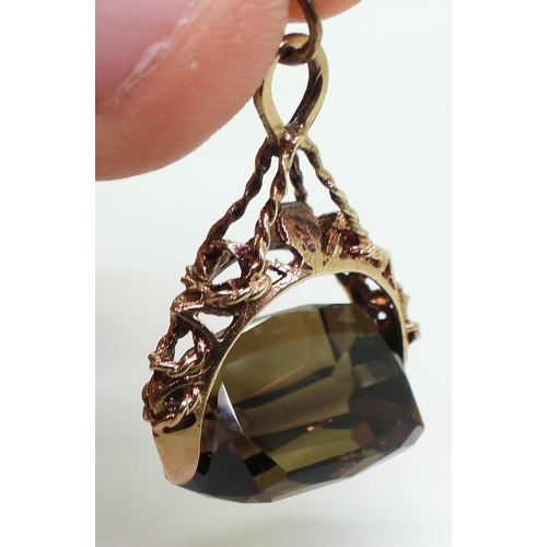 785 - A 9ct gold smoky quartz fob seal together with a 9ct gold Ward Brothers bow brooch with a 9ct carnel... 