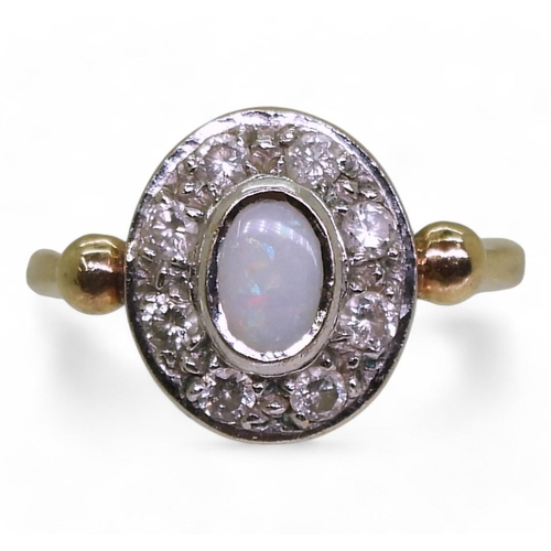 802 - A 9ct gold opal and diamond cluster ring, set with a white opal of approx 6mm x 4mm and estimated ap... 