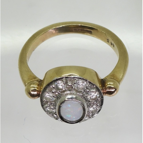 802 - A 9ct gold opal and diamond cluster ring, set with a white opal of approx 6mm x 4mm and estimated ap... 