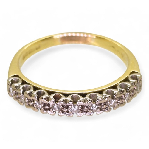 803 - An 18ct yellow and white gold eternity ring, set with estimated approx 0.20cts of brilliant cut diam... 