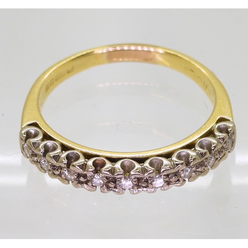 803 - An 18ct yellow and white gold eternity ring, set with estimated approx 0.20cts of brilliant cut diam... 