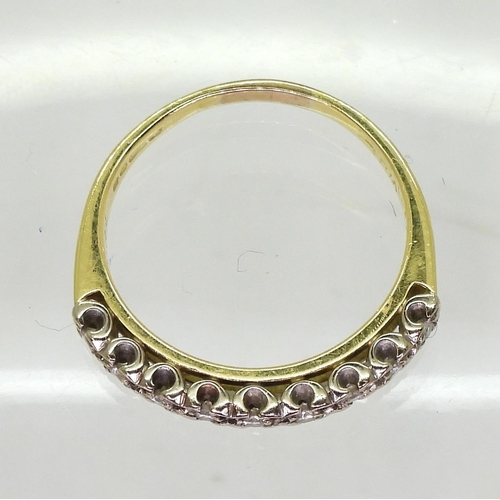 803 - An 18ct yellow and white gold eternity ring, set with estimated approx 0.20cts of brilliant cut diam... 