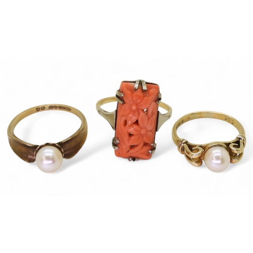 805 - A 9ct gold coral ring carved with flowers, size N, together with two 9ct gold pearl set rings sizes ... 