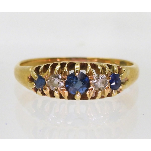 808 - A yellow metal ring set with old cut diamonds and blue gems, size n, weight 2.3gms