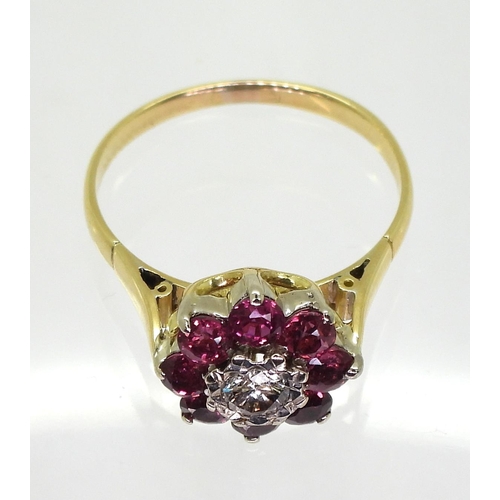 815 - A ruby and diamond flower ring, set in bright yellow metal, diamond estimated approx 0.10cts, finger... 