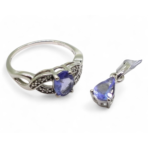 819 - A 9ct white gold tanzanite and diamond ring, size M, weight 2gms, together with a silver tanzanite p... 