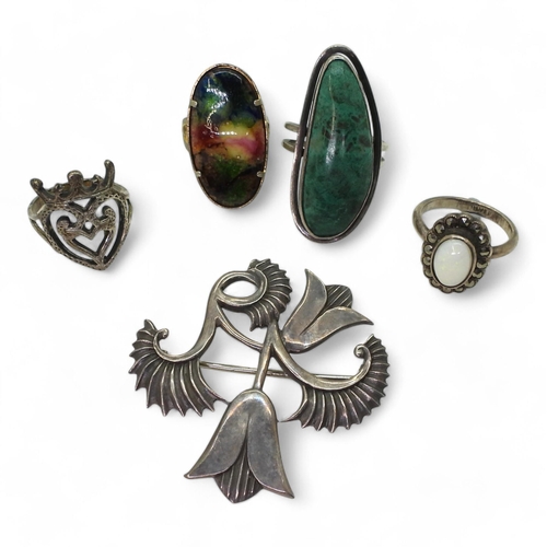 A Silver brooch made by Geoffrey G. Bellamy, for George Tarratt marked for Birmingham 1956, together with a silver mounted opal and marcasite ring, a white metal luckenbooth ring and two others