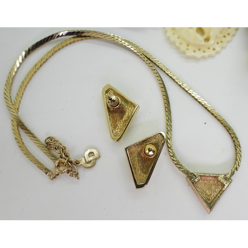 883 - A vintage gold plated necklace marked Christian Dior together with matching earrings, probably from ... 