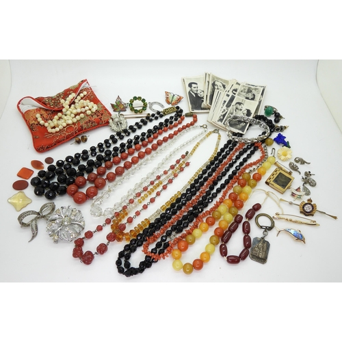 885 - Collection of beads including cherry amber coloured, coral, glass and red jasper, together with unmo... 