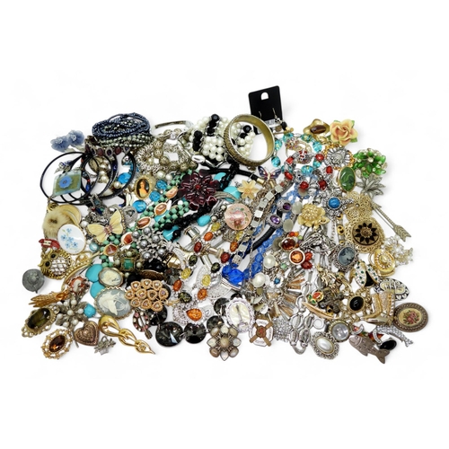 890 - Large collection of costume jewellery, including brooches, one marked Miracle, beaded necklaces, and... 