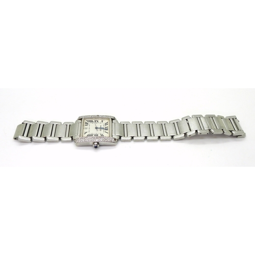 820 - A ladies stainless steel watch the 'Tank' shaped case set with brilliant cut diamonds, The dial, bac... 