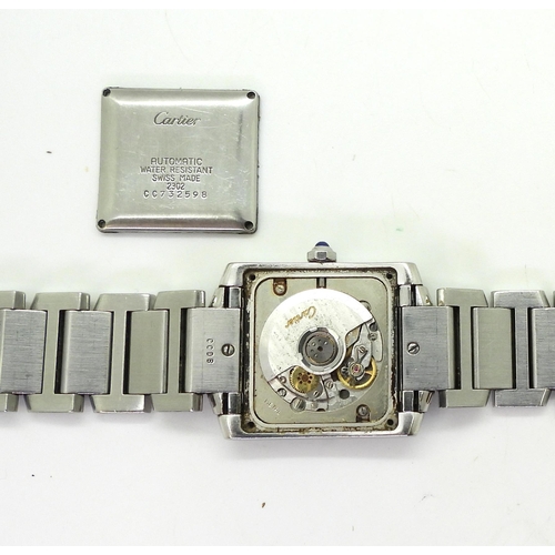 820 - A ladies stainless steel watch the 'Tank' shaped case set with brilliant cut diamonds, The dial, bac... 