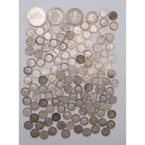 409 - A coin collection comprising silver coins to include a Canada Dollar 1966, George V half crowns 1920... 