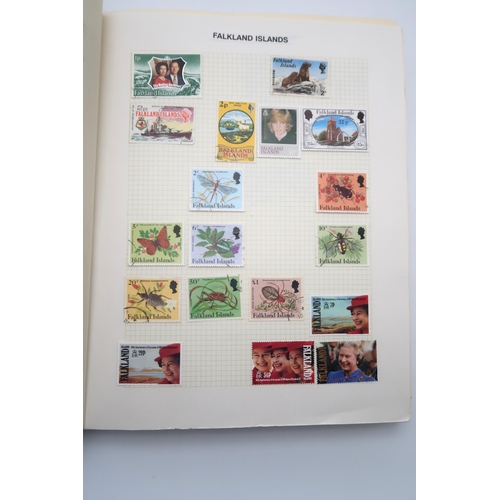 448 - An extensive worldwide stamp collection, mostly used, in 29 albums and a few stock books together wi... 