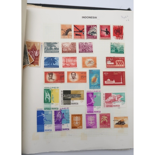 448 - An extensive worldwide stamp collection, mostly used, in 29 albums and a few stock books together wi... 