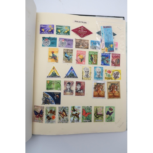 448 - An extensive worldwide stamp collection, mostly used, in 29 albums and a few stock books together wi... 