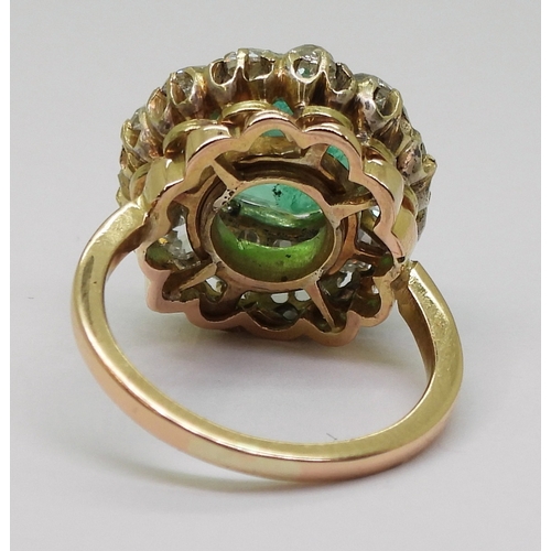 2770 - AN EMERALD STATEMENT RINGthe bright yellow metal mount is set with a step cut emerald of approx 8.7m... 