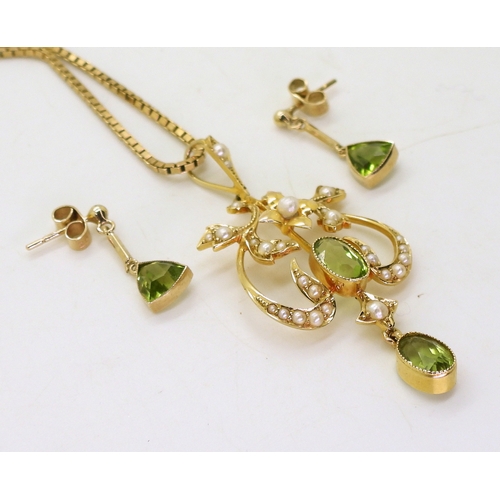 2773 - A PERIDOT SUITEcomprising of a 15ct gold Edwardian pendant set with peridot and pearls, weight 4.2gm... 