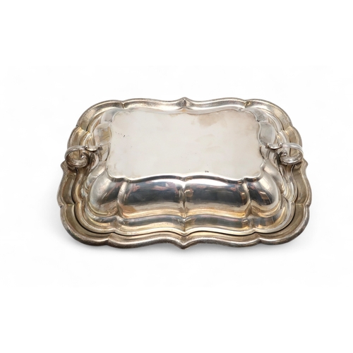 2534 - AN AMERICAN SILVER TUREEN AND COVERby Reed & Barton, of lobed rectangular form, with twin double... 