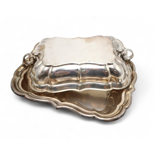 2534 - AN AMERICAN SILVER TUREEN AND COVERby Reed & Barton, of lobed rectangular form, with twin double... 